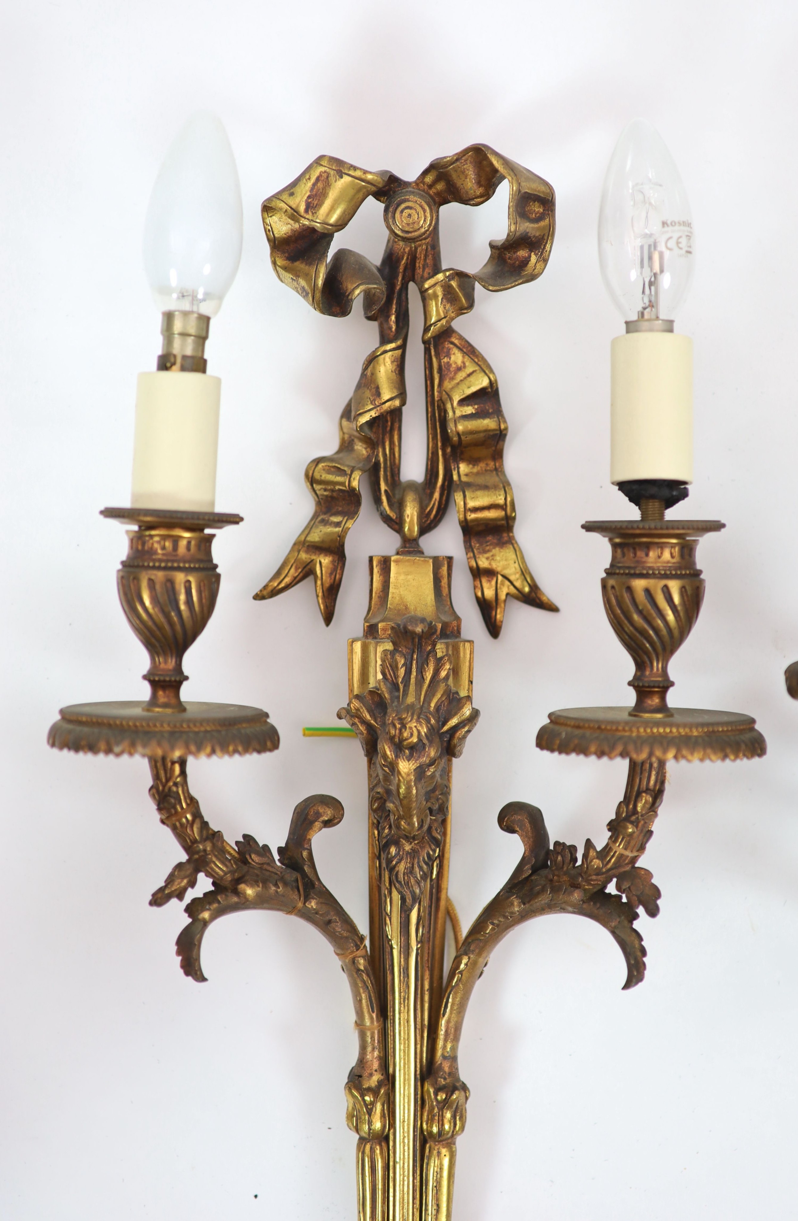 Two pairs of Adam Revival ram's mask head motif wall lights H 59cm. W 29cm. & H 59cm. W 23cm.